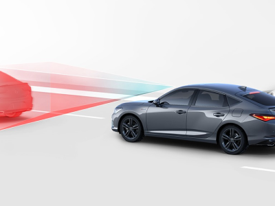 Digital rendering, where everything is white except for the Integra. 3/4 side rear view of grey Integra driving on road. Blue and red sensor lines emitting from the front of the Integra detect the car in front.