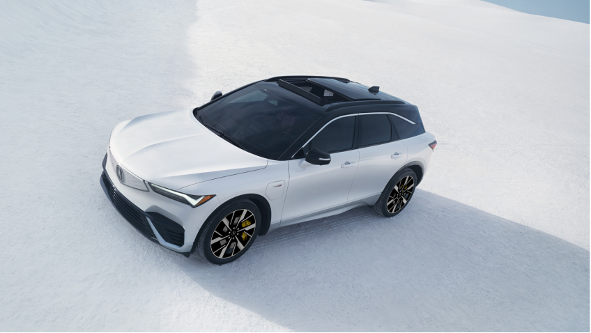 3/4 bird’s eye front view of a white ZDX parked on a salt flat.